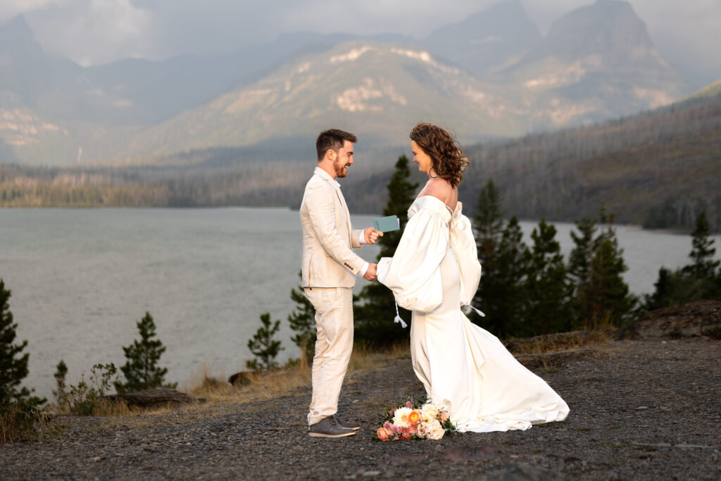 Couple sharing vows in front of mountain