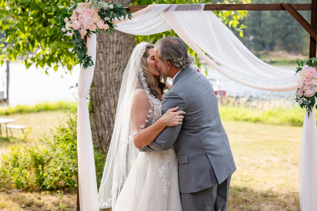 Bride and groom kissing when announced as husband and wife