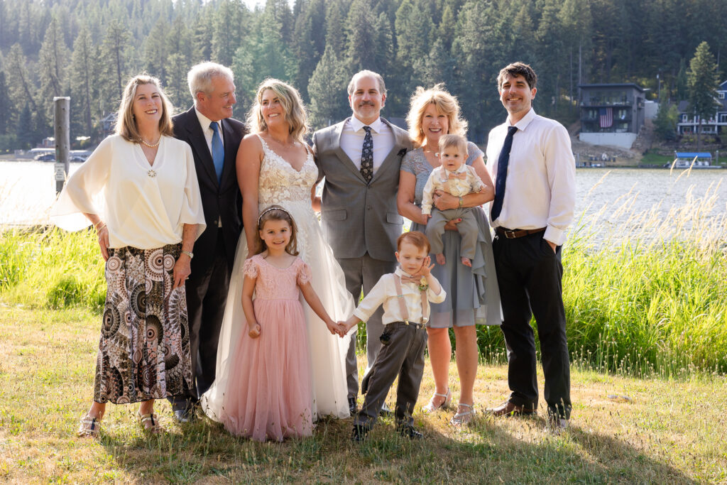 Family portraits by the lake kids holding hands