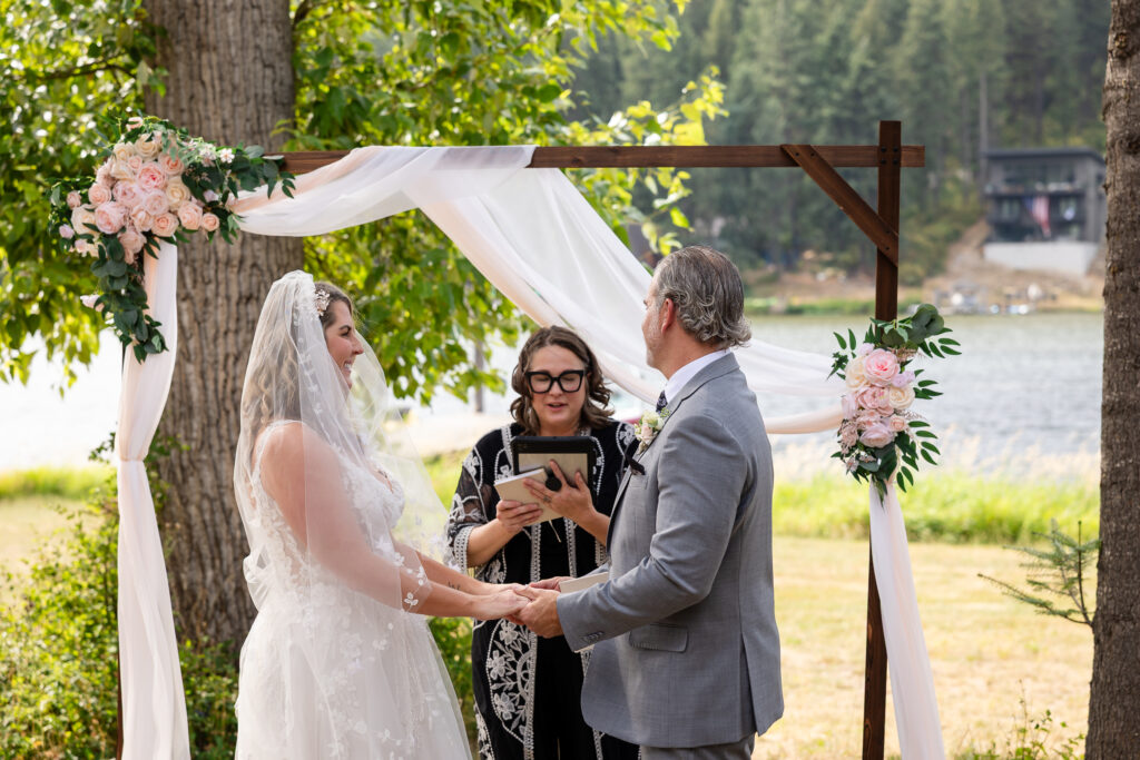 Couple holding hands during ceremony